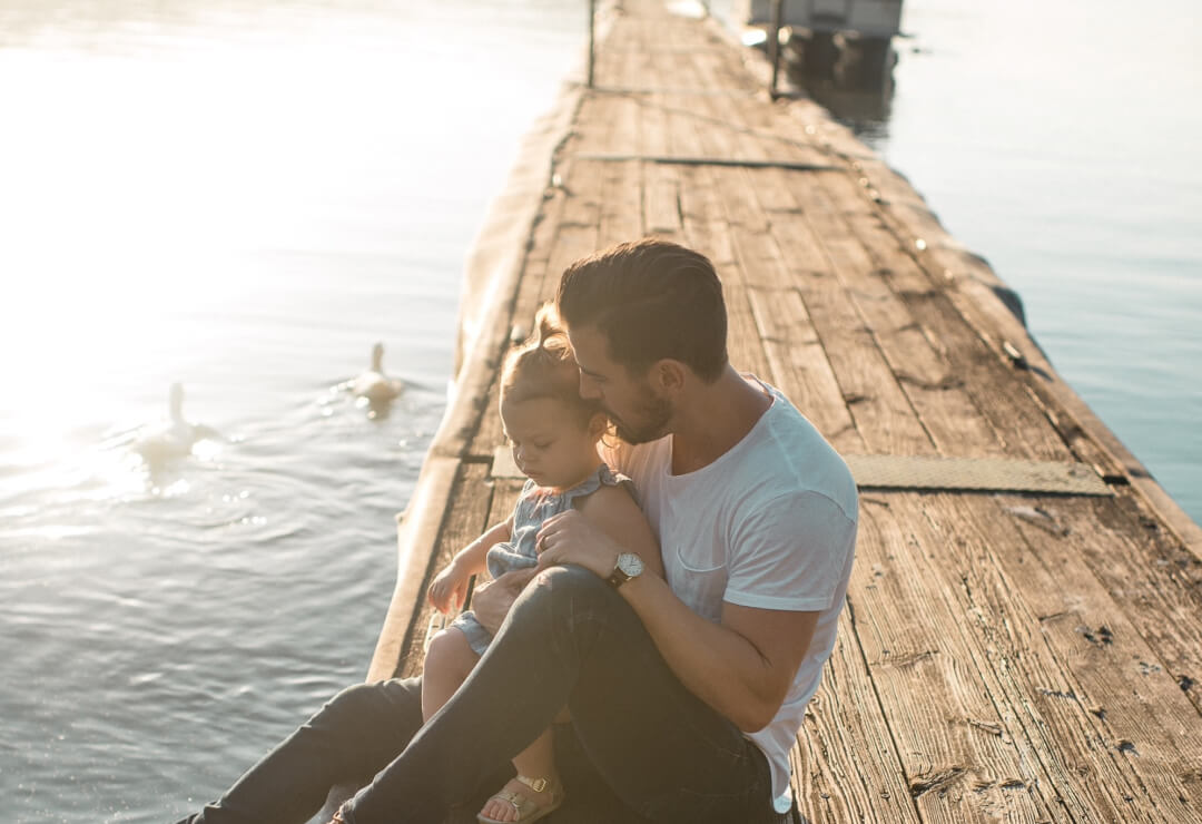 Father and daughter on jetty